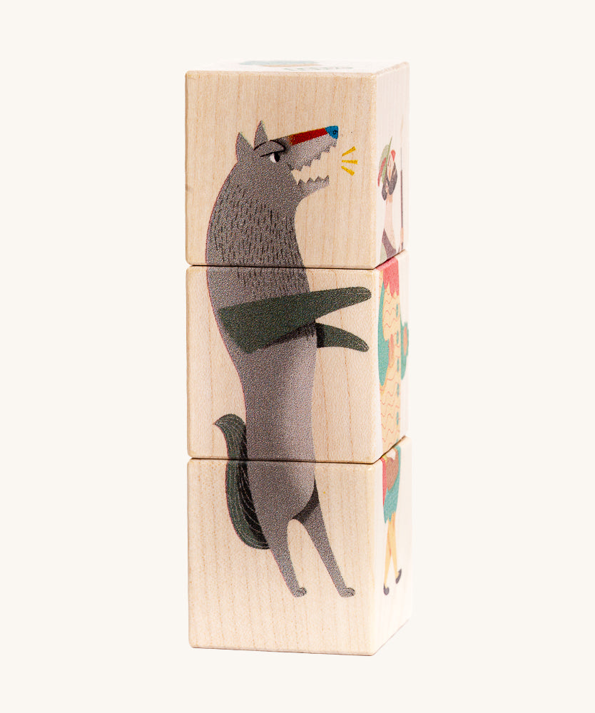 Bajo Little Red Riding Hood Turning Blocks. Three wooden blocks that are attached to each other, each block side features a piece of a character from the little red riding hood than can be twisted to mix and match the character.  These heirloom quality toys by Bajo are part of a wide range of wooden toys available here at Babipur.