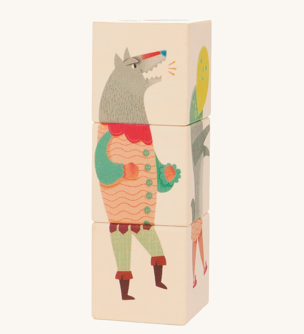 Bajo Little Red Riding Hood Turning Blocks. Three wooden blocks that are attached to each other, each block side features a piece of a character from the little red riding hood than can be twisted to mix and match the character.  These heirloom quality toys by Bajo are part of a wide range of wooden toys available here at Babipur.