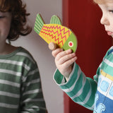 Bajo magnetic fishing game toy yellow fish piece in a child's hand. 