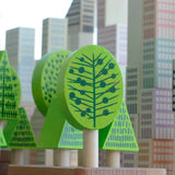 Trees from Bajo's forest central park set with the wooden Manhattan blocks in the background