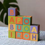 Bajo Me & You Alphabet Blocks stacked up on top of each other. 