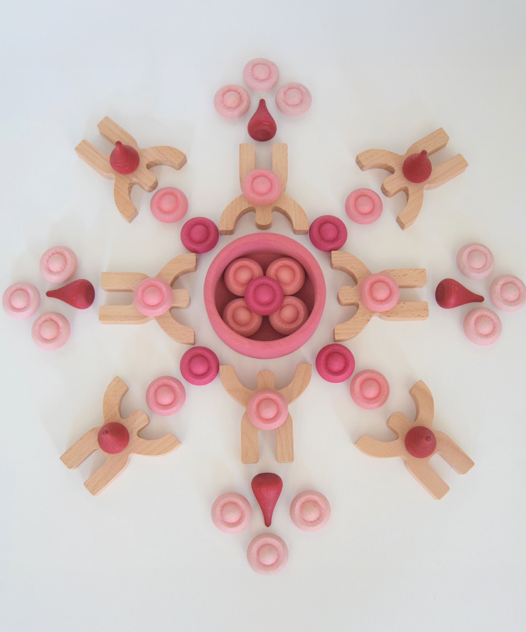 Bajo Mendelsons wooden Balancing Game. The wooden figures from this set have been used with Grapat mandala pieces to create a mandala. 