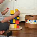 Child stacking blocks from the Bajo toys wooden Mondrian building blocks set.
