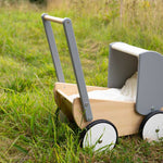 Bajo Monochrome wooden Doll's Pram outdoors on grass