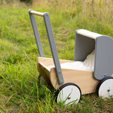 Bajo Monochrome wooden Doll's Pram outdoors on grass