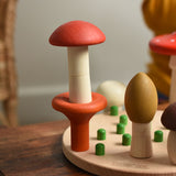 Two mushrooms from the Bajo Wooden Mushroom Forest Peg Puzzle stacked on top of each other. These heirloom quality toys by Bajo are part of a wide range of wooden toys available here at Babipur. 
