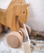A close up of the Bajo wooden jumping horse showing the detail on the horse's head