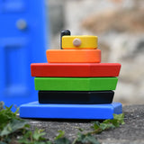 Bajo nemo boat stacker toy placed on a stone wall outdoors. 