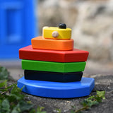  Bajo nemo boat stacker toy placed on a stone wall outdoors.