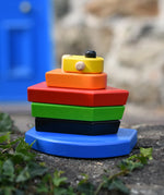  Bajo nemo boat stacker toy placed on a stone wall outdoors.