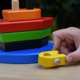 Child playing with the Bajo nemo boat stacker toy pushing the yellow boat piece along.