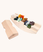 Coloured wooden animal figures placed inside the Bajo Noah's ark wooden toy. The ark is shown with the roof piece taken off and placed besides the rest of the boat. These heirloom quality toys by Bajo are part of a wide range of wooden toys available here at Babipur. 