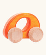 Bajo handmade wooden ellipse car in orange with a oval cut out in the center for grip and unpainted wheels