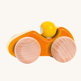 An orange coloured Bajo wooden racing car, the car has natural wooden wheels. This car is part of a wide range of Bajo wooden toy vehicles available at Babipur.