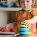 Build and stack with these wonderfully smooth and tactile 10 round wooden Pebbles by Bajo in shades of blue