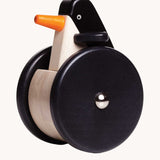 Bajo wobbling penguin push along wooden toy. This toy penguin has large black wheels. These heirloom quality toys by Bajo are part of a wide range of wooden toys available here at Babipur. 