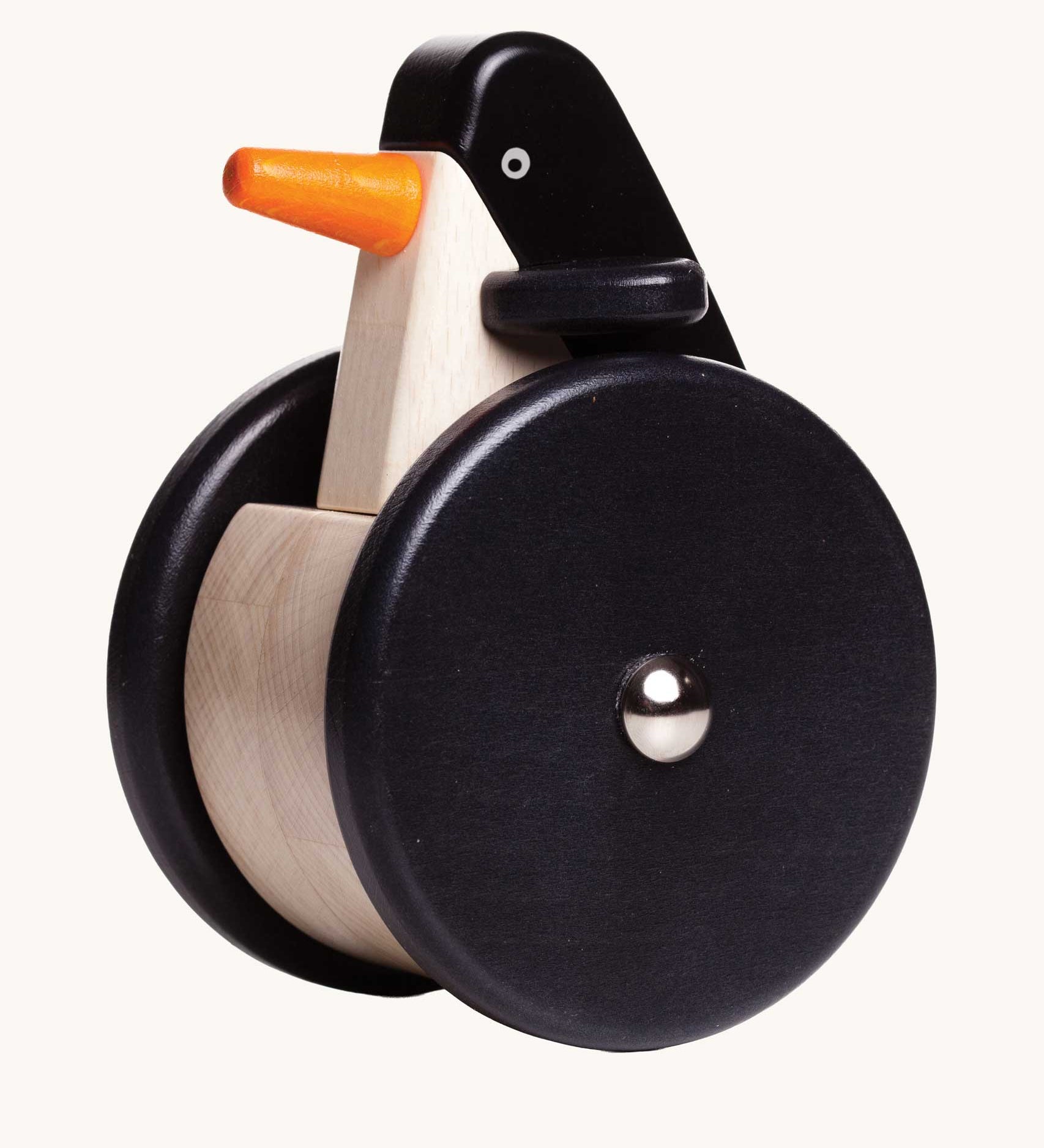 Bajo wobbling penguin push along wooden toy. This toy penguin has large black wheels. These heirloom quality toys by Bajo are part of a wide range of wooden toys available here at Babipur. 