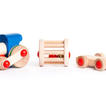 Bajo children's pull along musical train toy laid out on a white background