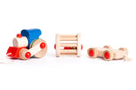 Bajo children's pull along musical train toy laid out on a white background