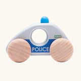 Side profile view of Bajo silver police car wooden toy vehicle. Silver car with blue details and natural wooden wheels.