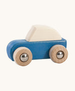 A blue coloured wooden pull back car from Bajo. This wooden car is is part of a wide range of Bajo wooden toy vehicles available at Babipur.