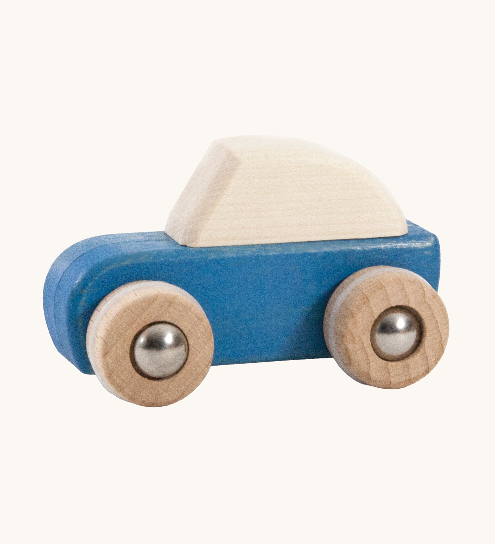 A blue coloured wooden pull back car from Bajo. This wooden car is is part of a wide range of Bajo wooden toy vehicles available at Babipur.