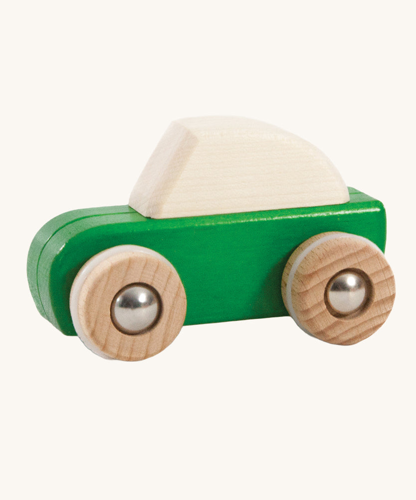 A green coloured wooden pull back car from Bajo. This wooden car is is part of a wide range of Bajo wooden toy vehicles available at Babipur.