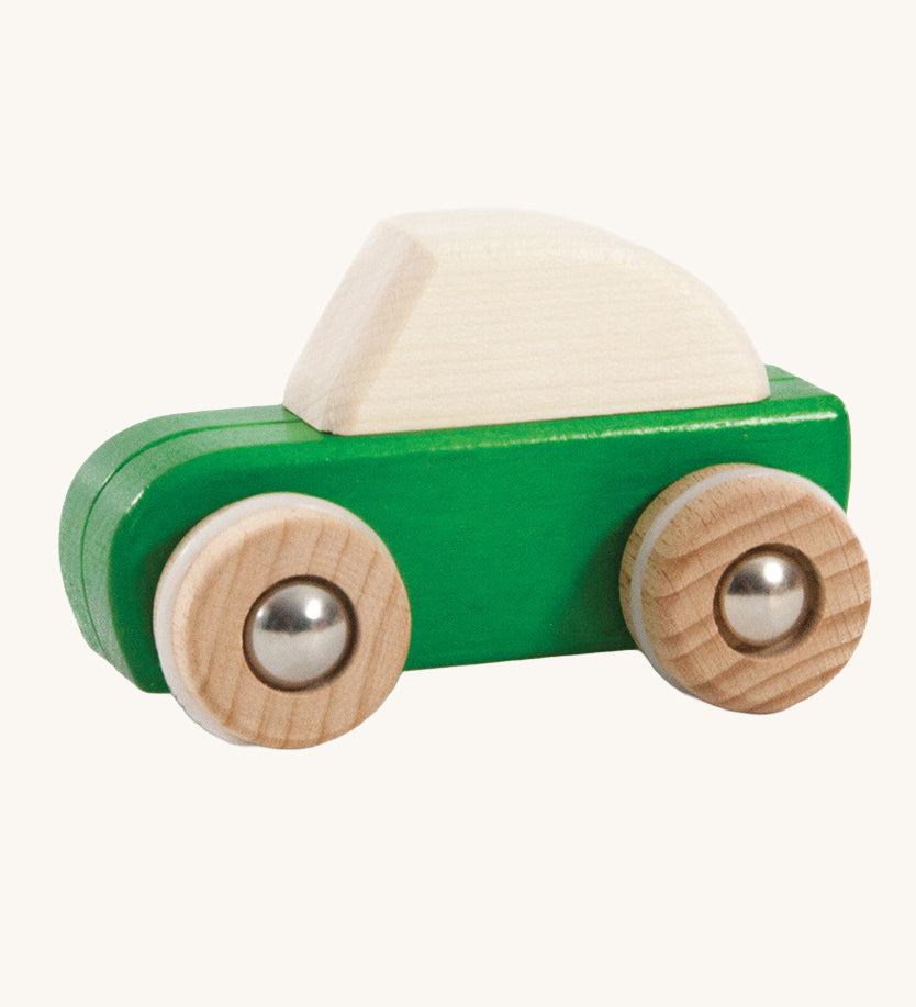 A green coloured wooden pull back car from Bajo. This wooden car is is part of a wide range of Bajo wooden toy vehicles available at Babipur.