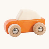 An orange coloured wooden pull back car from Bajo. This wooden car is is part of a wide range of Bajo wooden toy vehicles available at Babipur.