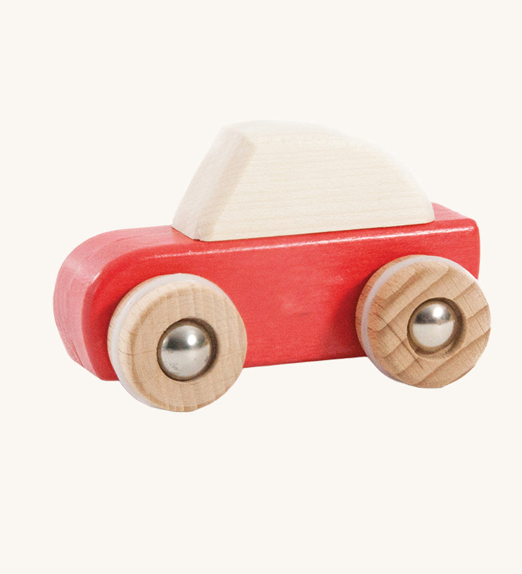 A red coloured wooden pull back car from Bajo. This wooden car is is part of a wide range of Bajo wooden toy vehicles available at Babipur.