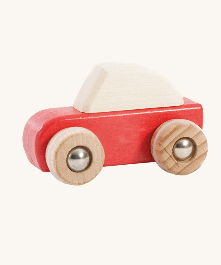A red coloured wooden pull back car from Bajo. This wooden car is is part of a wide range of Bajo wooden toy vehicles available at Babipur.