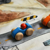 A blue Bajo racing cars  placed on a Wonderie building site play cloth. These heirloom quality toys by Bajo are part of a wide range of wooden toys available here at Babipur. 