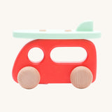 Bajo Camper Van With Surf Board wooden toy vehicle. This red camper van toy comes with a green coloured surf board that sits on the roof. 
These heirloom quality toys by Bajo are part of a wide range of wooden toys available here at Babipur. 
