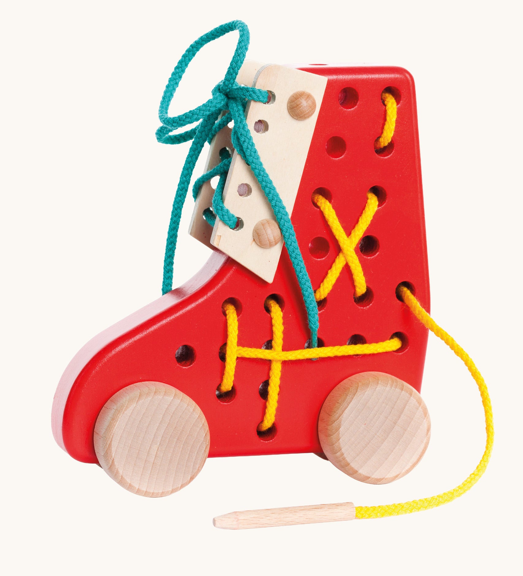 Bajo red Lacing Shoe wooden toy. A red boot shaped threading toy with wheels. These heirloom quality toys by Bajo are part of a wide range of wooden toys available here at Babipur. 