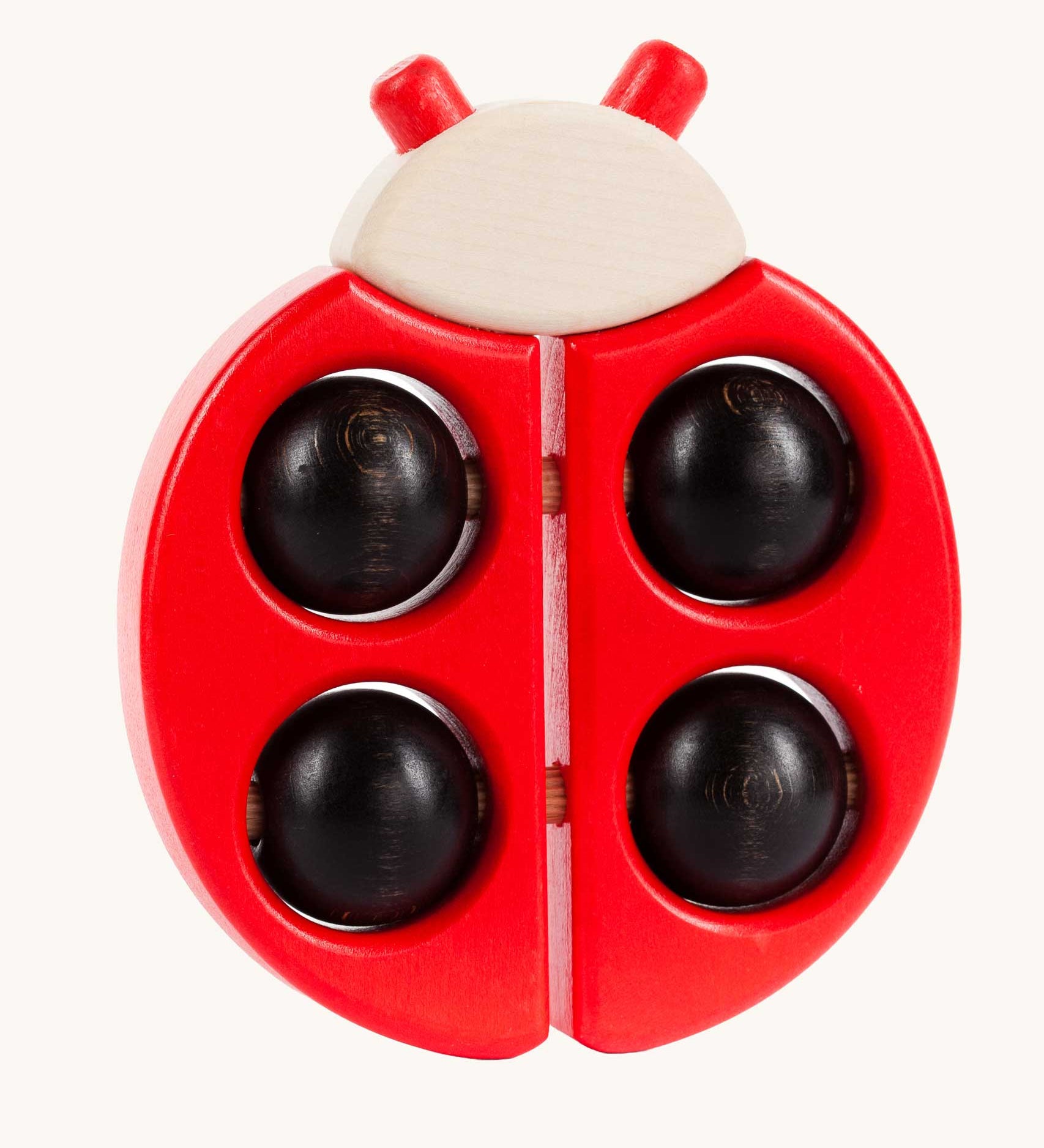 Bajo Red Ladybird Teether, a red coloured wooden teether toy with black coloured ball details. 