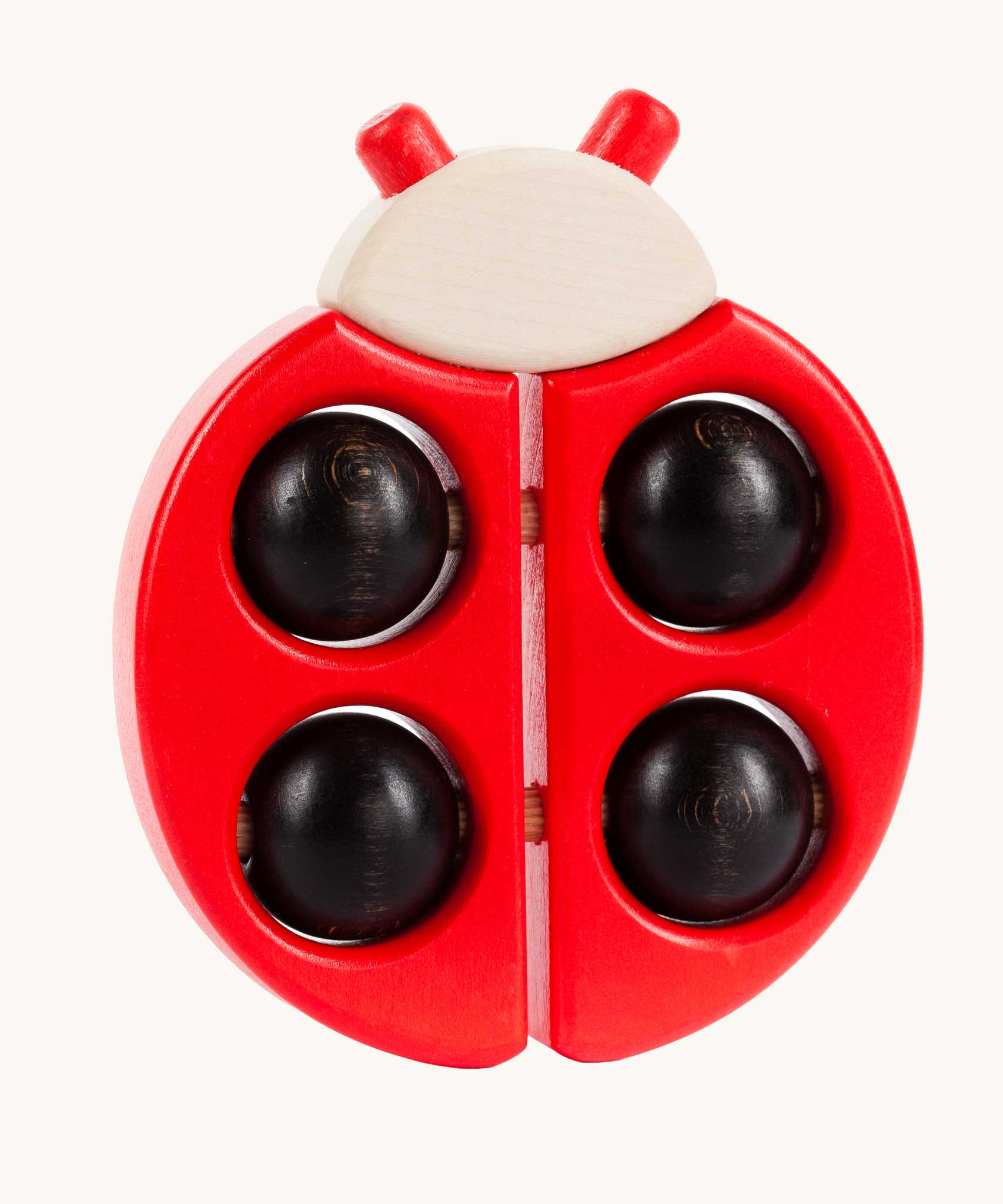 Bajo Red Ladybird Teether, a red coloured wooden teether toy with black coloured ball details. 