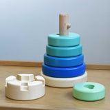 A blue coloured Bajo wooden rook stacking tower toy placed on a Miri slide. These heirloom quality toys by Bajo are part of a wide range of wooden toys available here at Babipur.