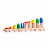 Bajo Rope Abacus. A wooden base with ropes attached and wooden rings, some coloured and some natural wood. These heirloom quality toys by Bajo are part of a wide range of wooden toys available here at Babipur. 