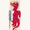 The Bajo Rotary Wooden Blocks Puzzle in a dragon design. The blocks are aligned to show a full dragon illustration