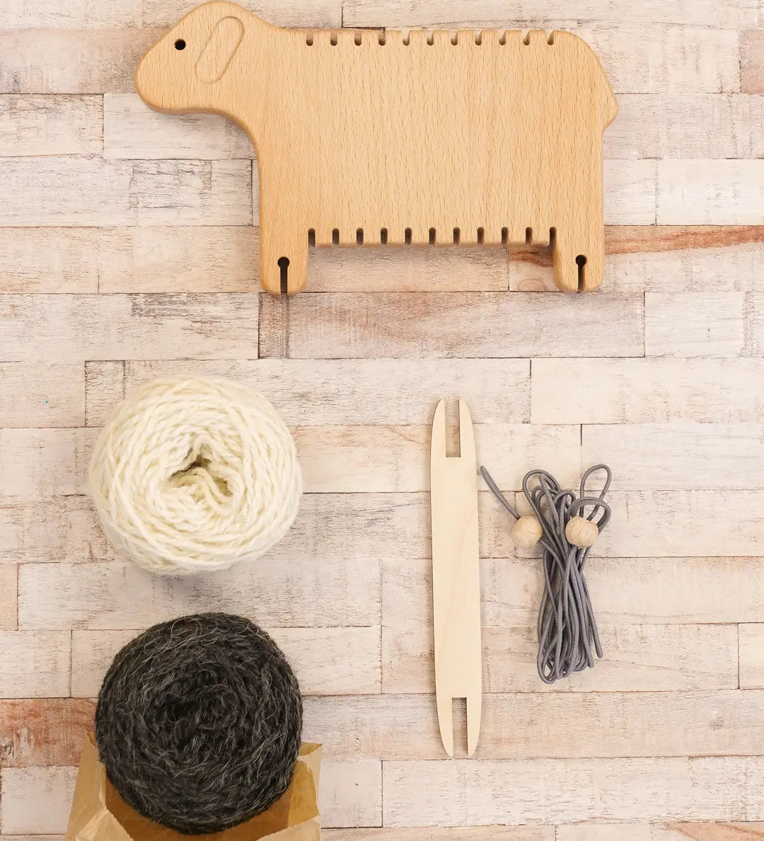 Bajo Weaving Sheep Loom set with a natural wooden loom frame.