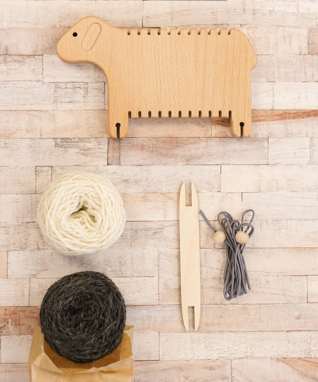 Bajo Weaving Sheep Loom set with a natural wooden loom frame.