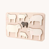 Bajo Sheep Puzzle. A wooden frame with 7 sheep shaped figures. 