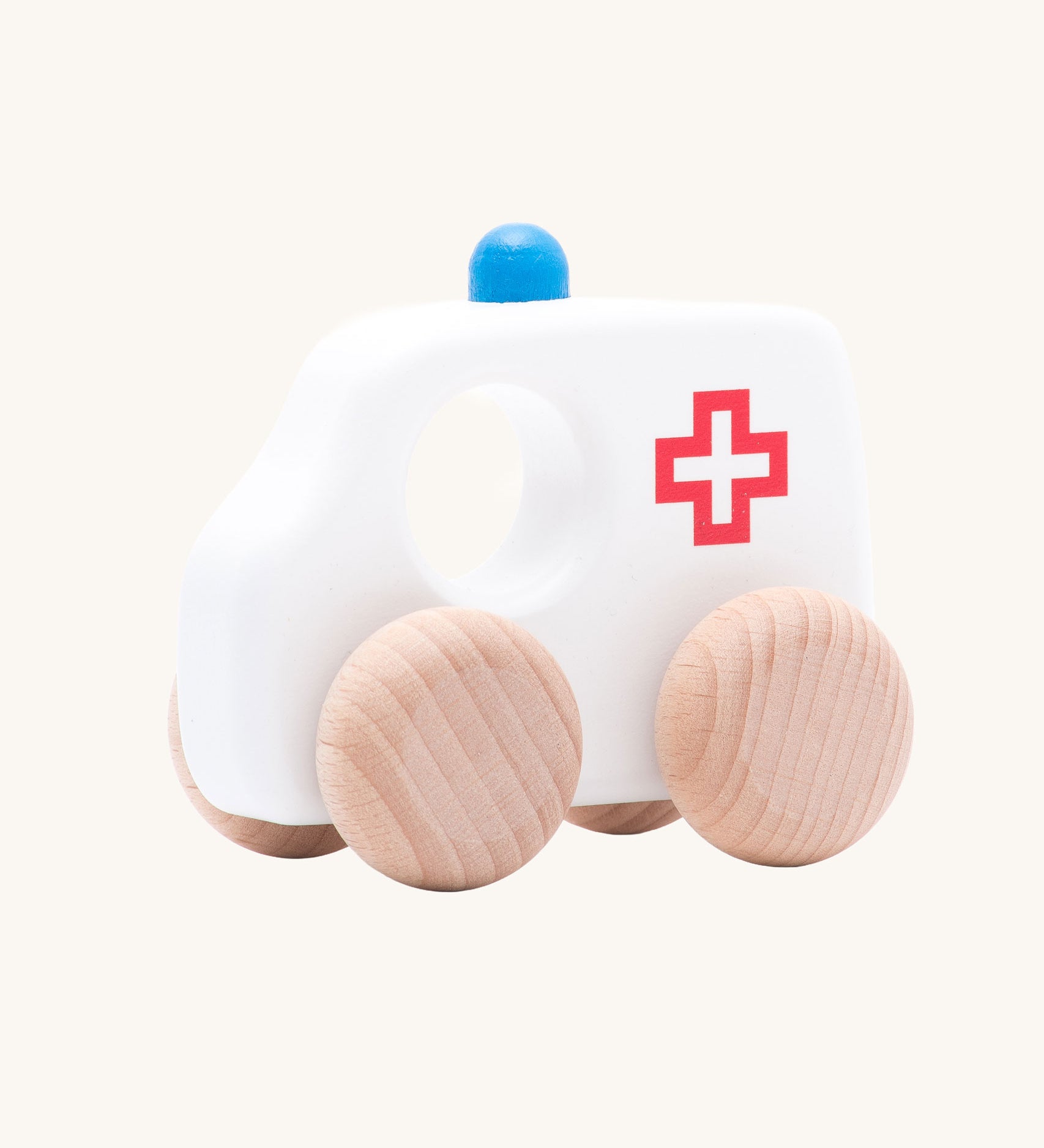 Bajo Small Ambulance wooden toy car. A white painted ambulance with natural wooden wheels. These heirloom quality toys by Bajo are part of a wide range of wooden toys available here at Babipur. 