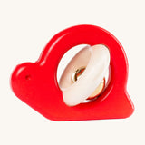 Bajo Snail Rattle baby toy. A red coloured Bajo snail baby toy. A red coloured snail with a bell detail.