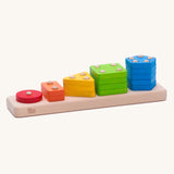 Bajo Sorting Board woodne toy. A wooden sorting toy featuring a wooden base with dowels and different shapes to place on them. These heirloom quality toys by Bajo are part of a wide range of wooden toys available here at Babipur. 