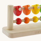 A close up of the birds on the Bajo Sparrow Abacus wooden toy. This abacus has 5 little birds and 5 round counters. These heirloom quality toys by Bajo are part of a wide range of wooden toys available here at Babipur.