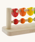 A close up of the birds on the Bajo Sparrow Abacus wooden toy. This abacus has 5 little birds and 5 round counters. These heirloom quality toys by Bajo are part of a wide range of wooden toys available here at Babipur.