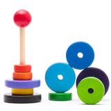 Bajo sustainable wooden stacker puzzle pieces scattered on a white background