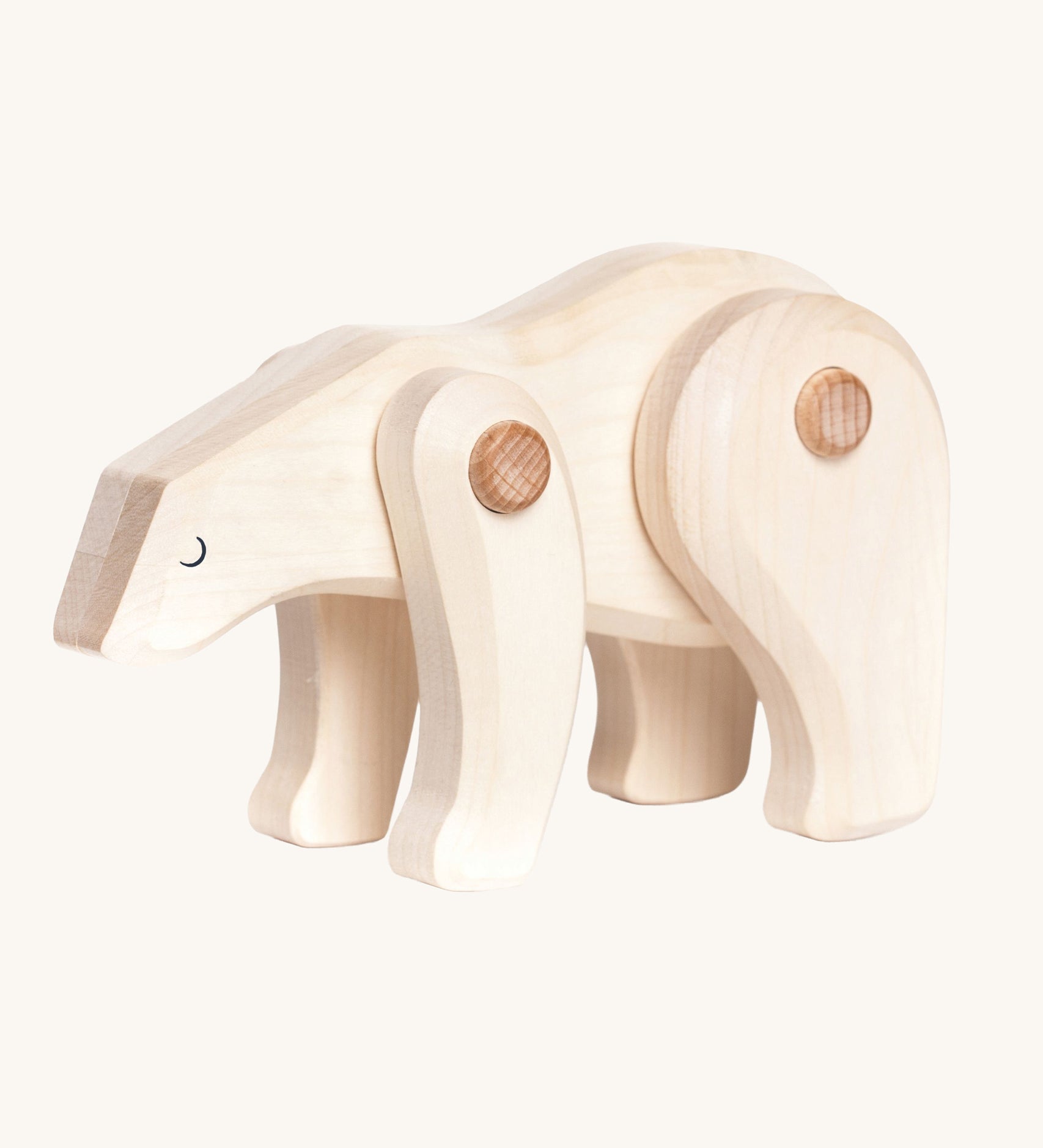 A white Tobe wooden polar bear toy. This polar bear figure has movable joints. A range of Tobe animals are available at Babipur. 