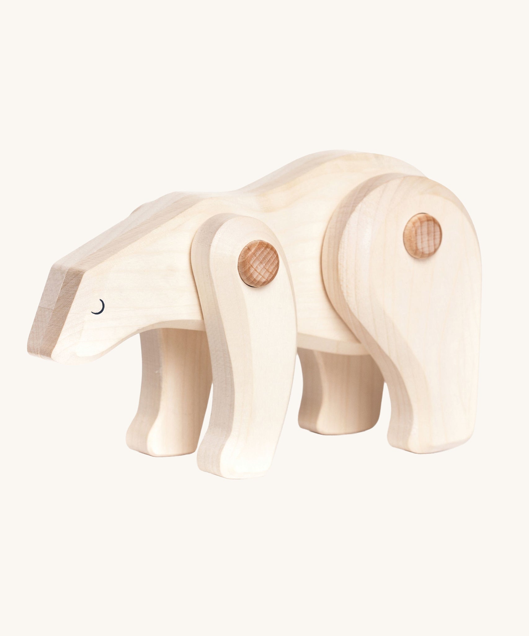 A white Tobe wooden polar bear toy. This polar bear figure has movable joints. A range of Tobe animals are available at Babipur. 